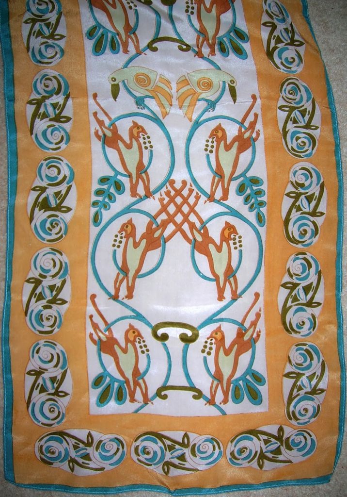 teal, butterscotch, orange and white celtic patterned scarf