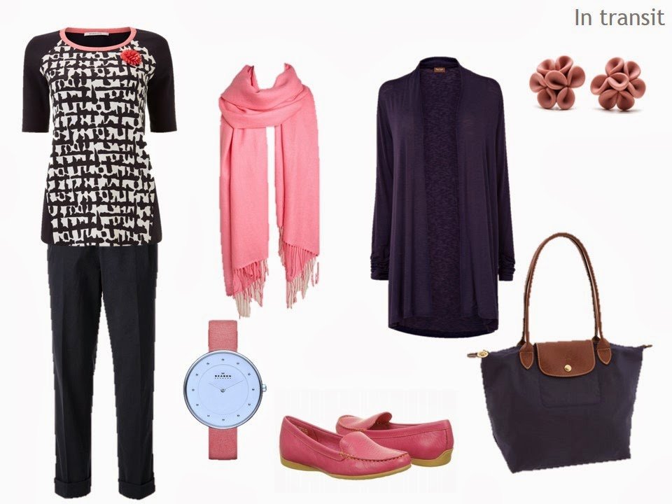 travel outfit in navy and coral, with a navy cardigan and pants, and coral scarf and loafers