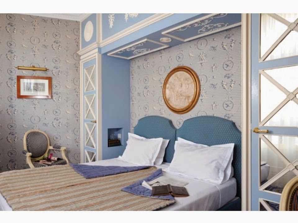 hotel room decorated in shades of beige and blue