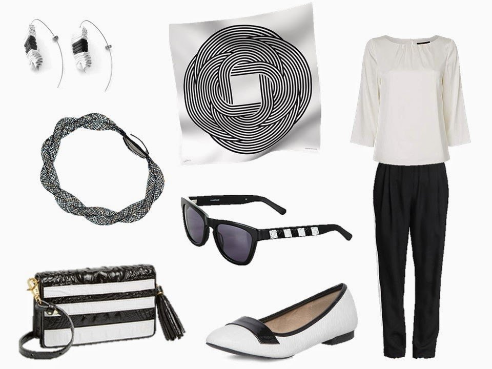 Hermes Maillons de Joel Stein with a white blouse, black pants, and related accessories