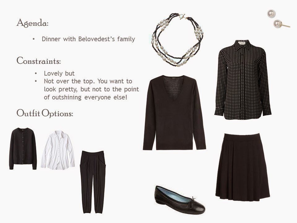 Black pleated skirt and v-neck sweater with a black and white patterned blouse, pearl jewelry, and black ballet flats