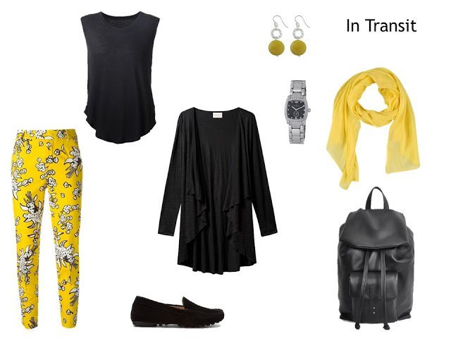travel outfit black cardigan and top, with yellow floral pants and yellow accessories