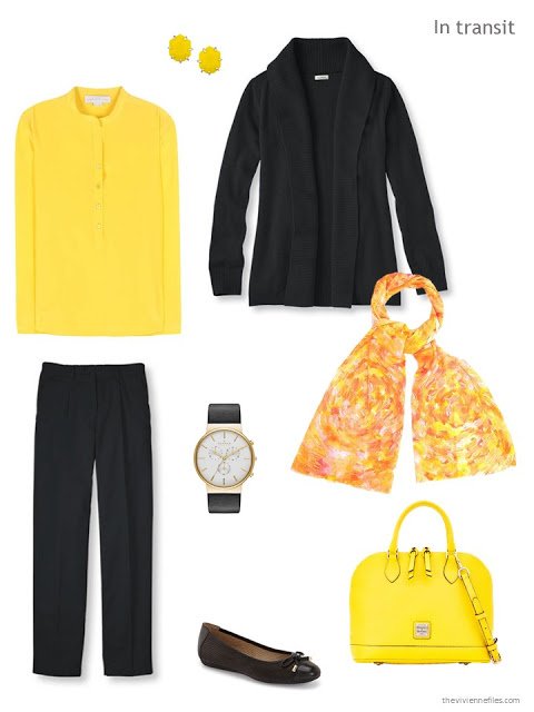 travel outfit in yellow and black, with a yellow silk blouse, yellow handbag and black cashmere cardigan