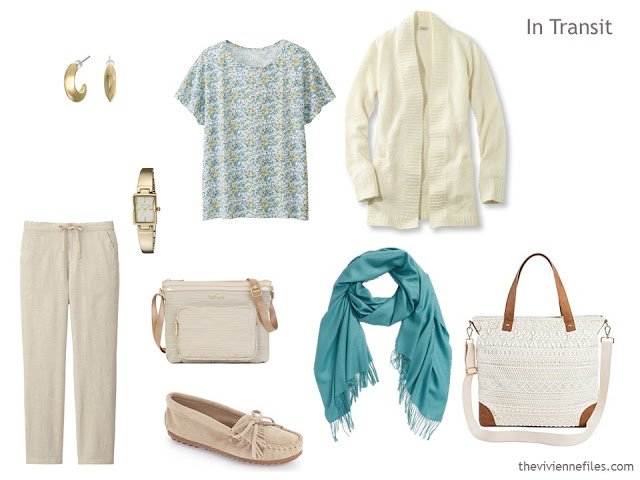 A travel outfit including beige trousers, a floral tee shirt and ivory cardigan.