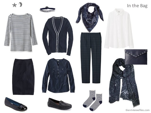 Travel capsule wardrobe in a navy, white, and grey color palette