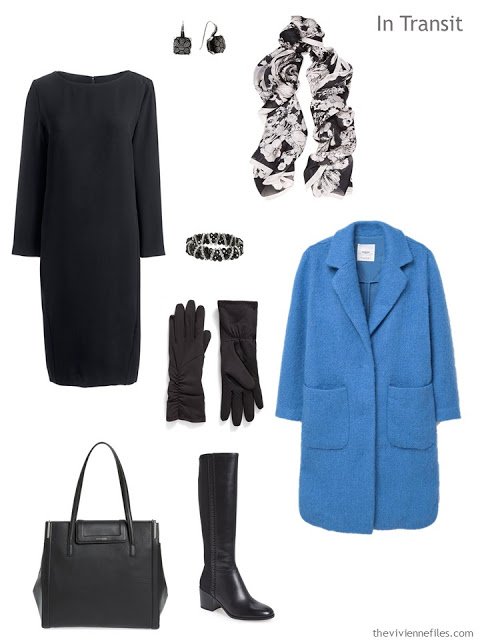 a travel outfit of a black dress with black accessories and a blue coat