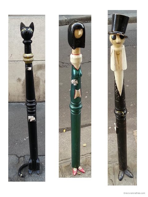 Paris street art decorated traffic control black metal poles