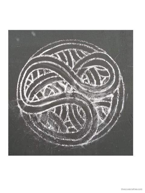 Paris street art chalk drawn Celtic motif circle