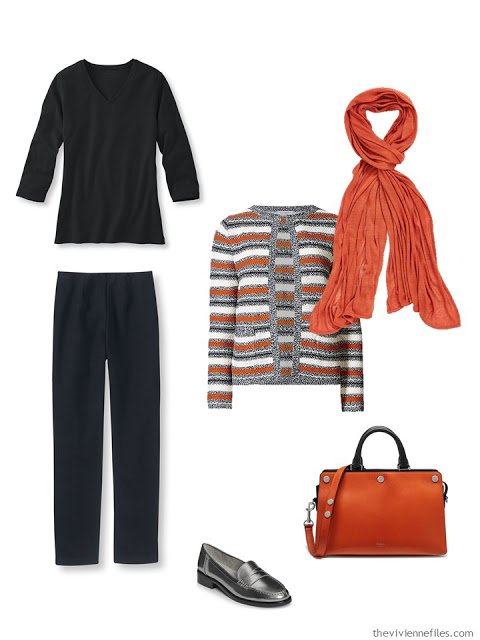 black outfit with orange and silver accents