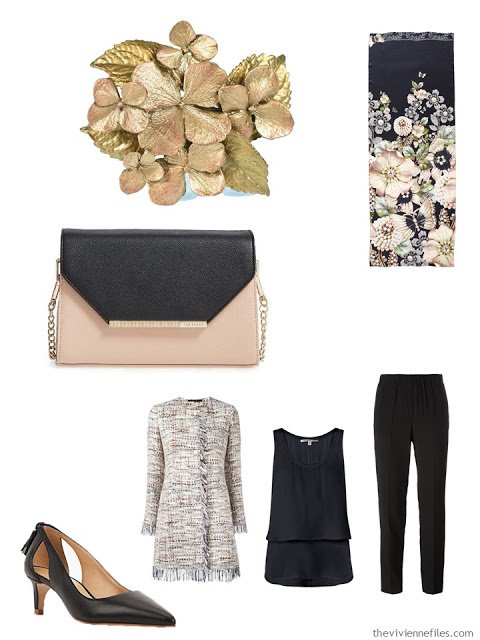 beige and black tweed jacket with black silk separates, a floral brooch, and two-toned handbag