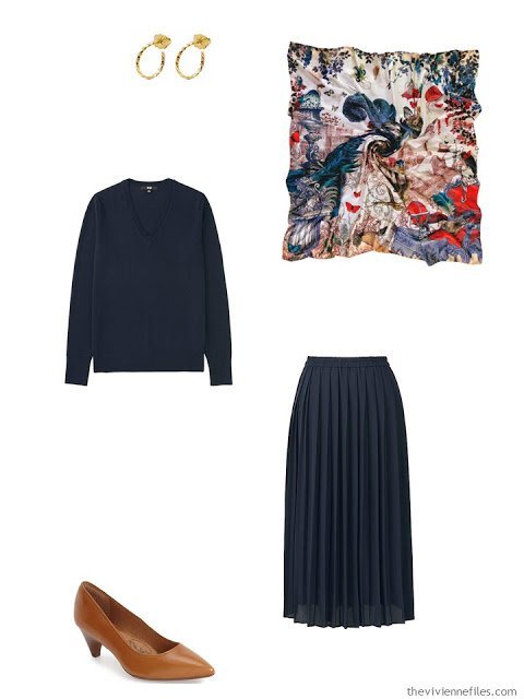 navy sweater and skirt with brown pumps, gold earrings and a silk scarf