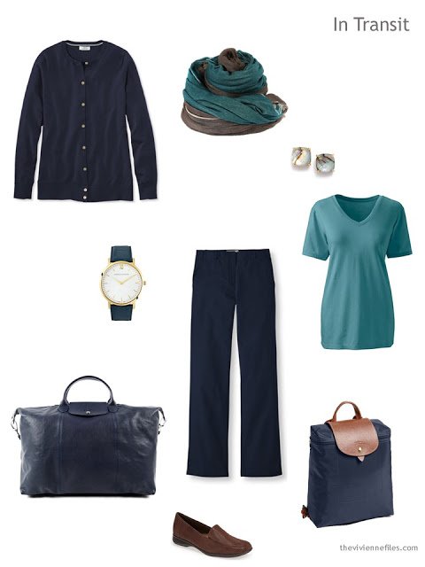 warm weather travel outfit in navy and teal with brown leather accents