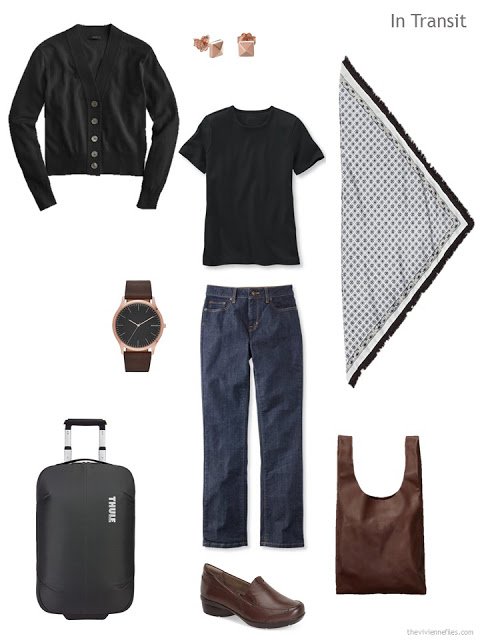 travel outfit in black and denim with brown leather accents