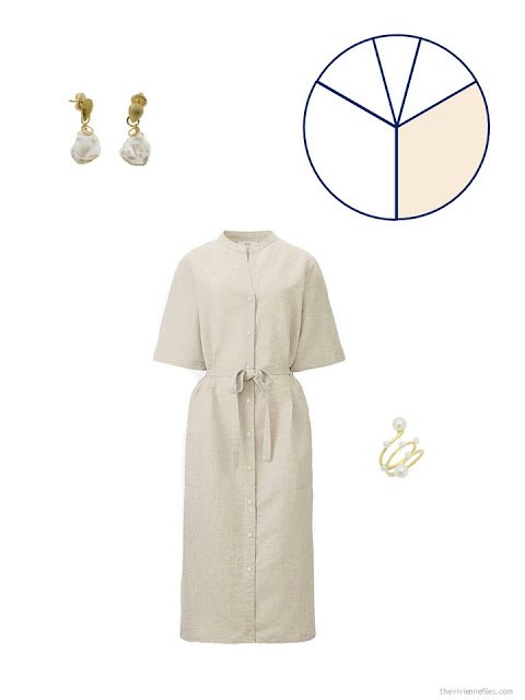 a simple beige dress with pearl jewelry