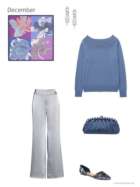 a blue sweater with silver satin pants