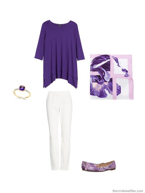 wearing an ultraviolet tunic with white denim pants