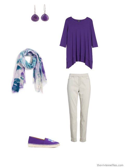 wearing an ultraviolet tunic with light grey pants
