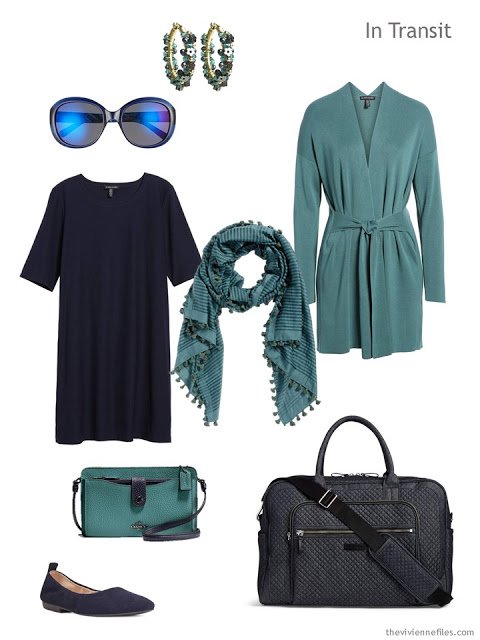travel outfit of a navy dress with muted teal cardigan and accessories