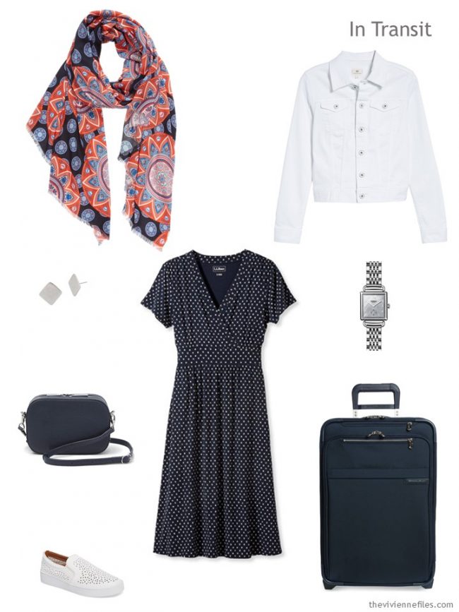 2. travel outfit of navy dress and white denim jacket