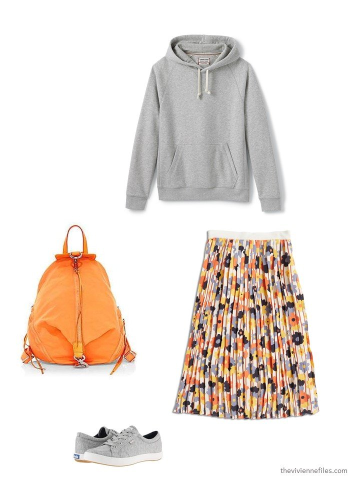 10. wearing a floral skirt with a sweatshirt