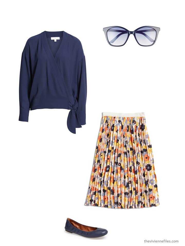 6.wearing a floral skirt with a navy blouse